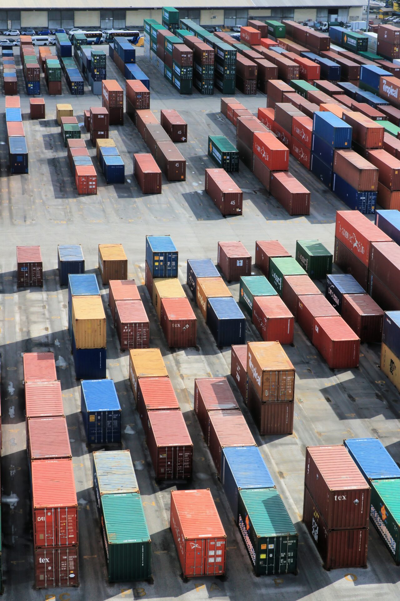 Container yard at a modern port, illustrating global technology logistics