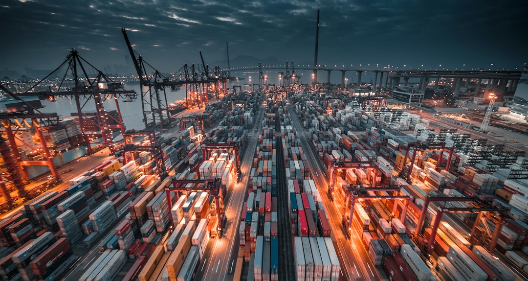 Cargo freight containers in a sea port (illustrative image)