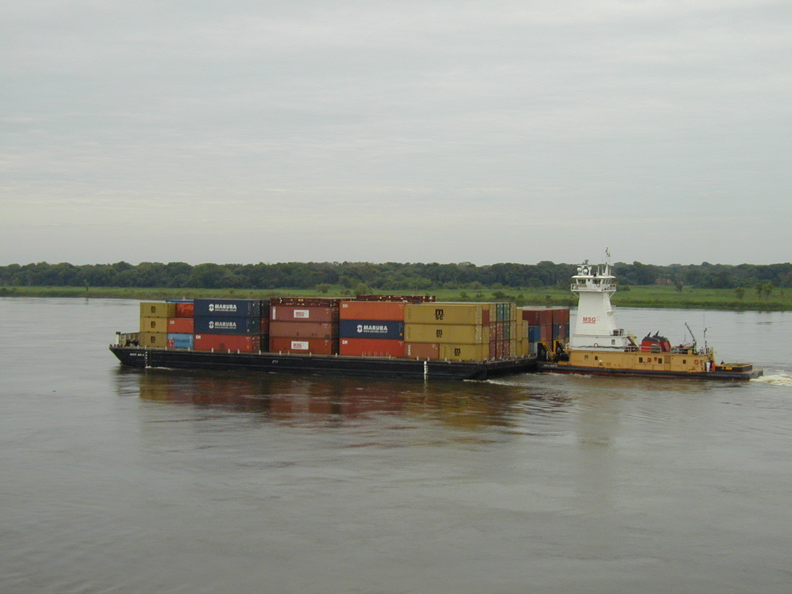 Container barge on the Paraguay River. Photo by Claudio Elias, public domain via Wikimedia Commons.
