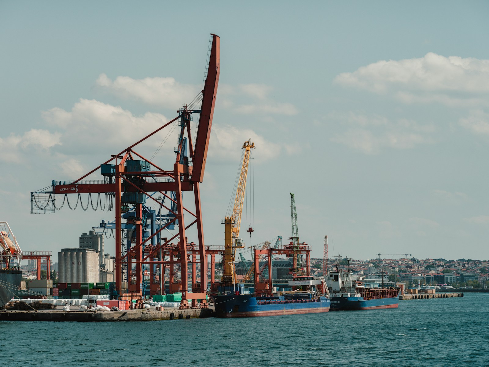 Container terminal with cranes loading cargo ships for ocean freight