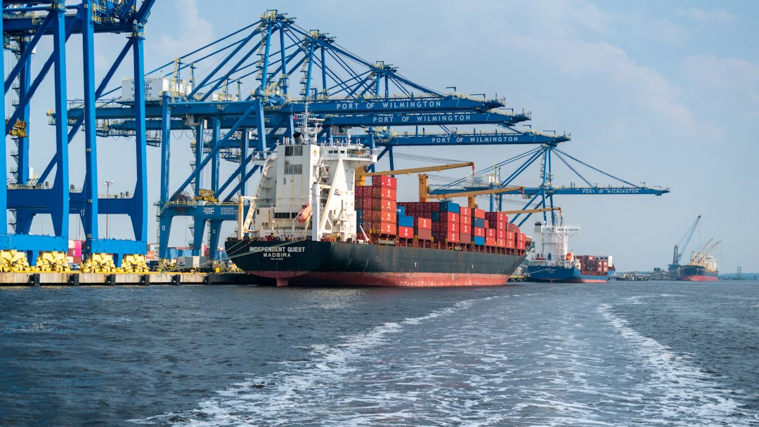 Container ship at a port with gantry cranes, illustrating Guatemala's two-coast shipping access