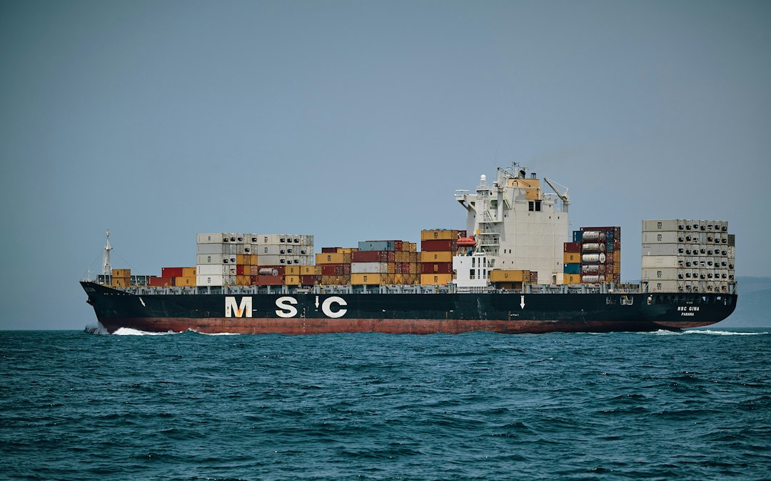 Large cargo ship carrying containers across the ocean