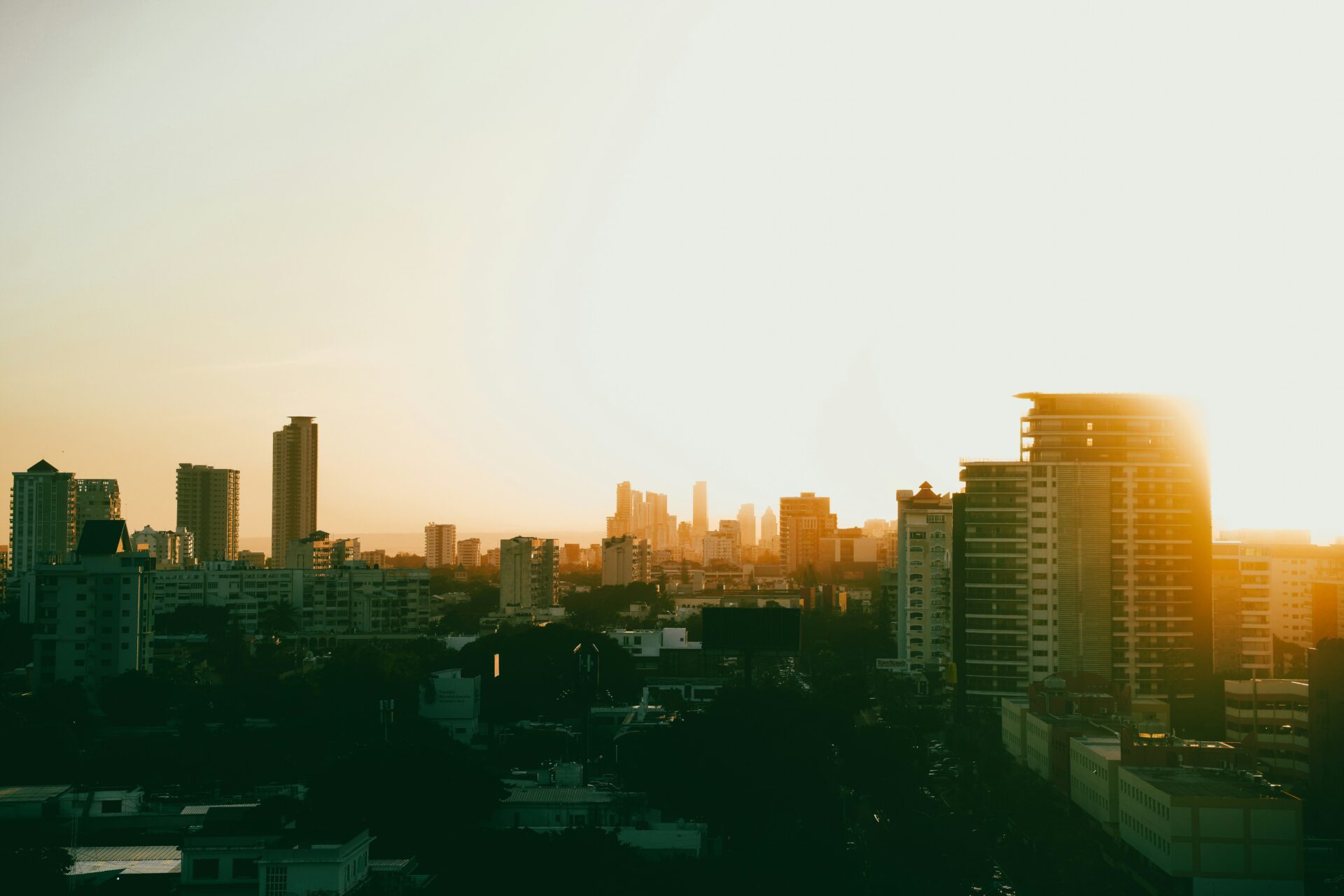 Latin American city skyline at sunset representing urban market opportunities