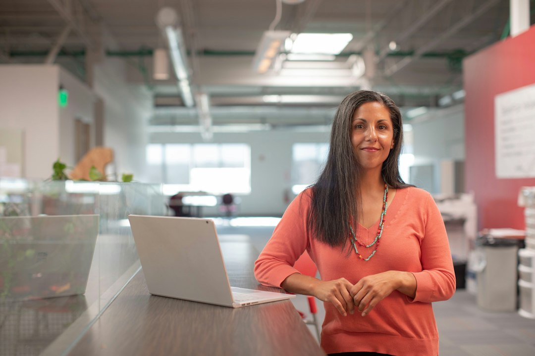 Woman at desk working in an office (illustrative image)